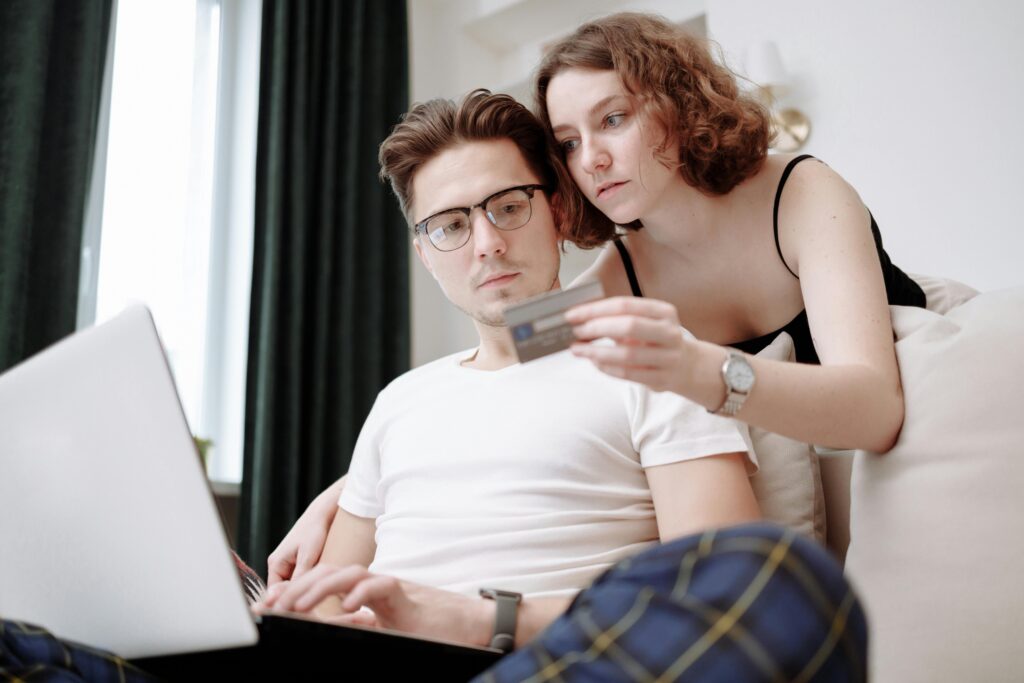 couple looking at credit card 