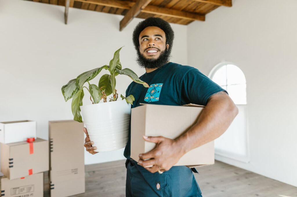 man moving out house