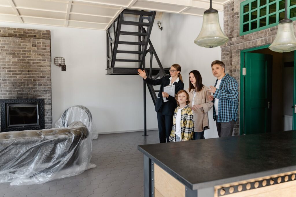 family being shown inside of home 