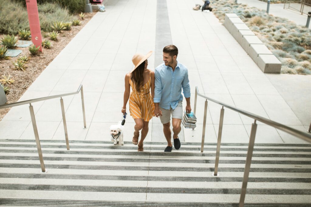 man and woman walking upstairs