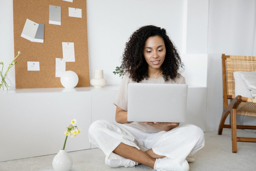 black woman researching on laptop
